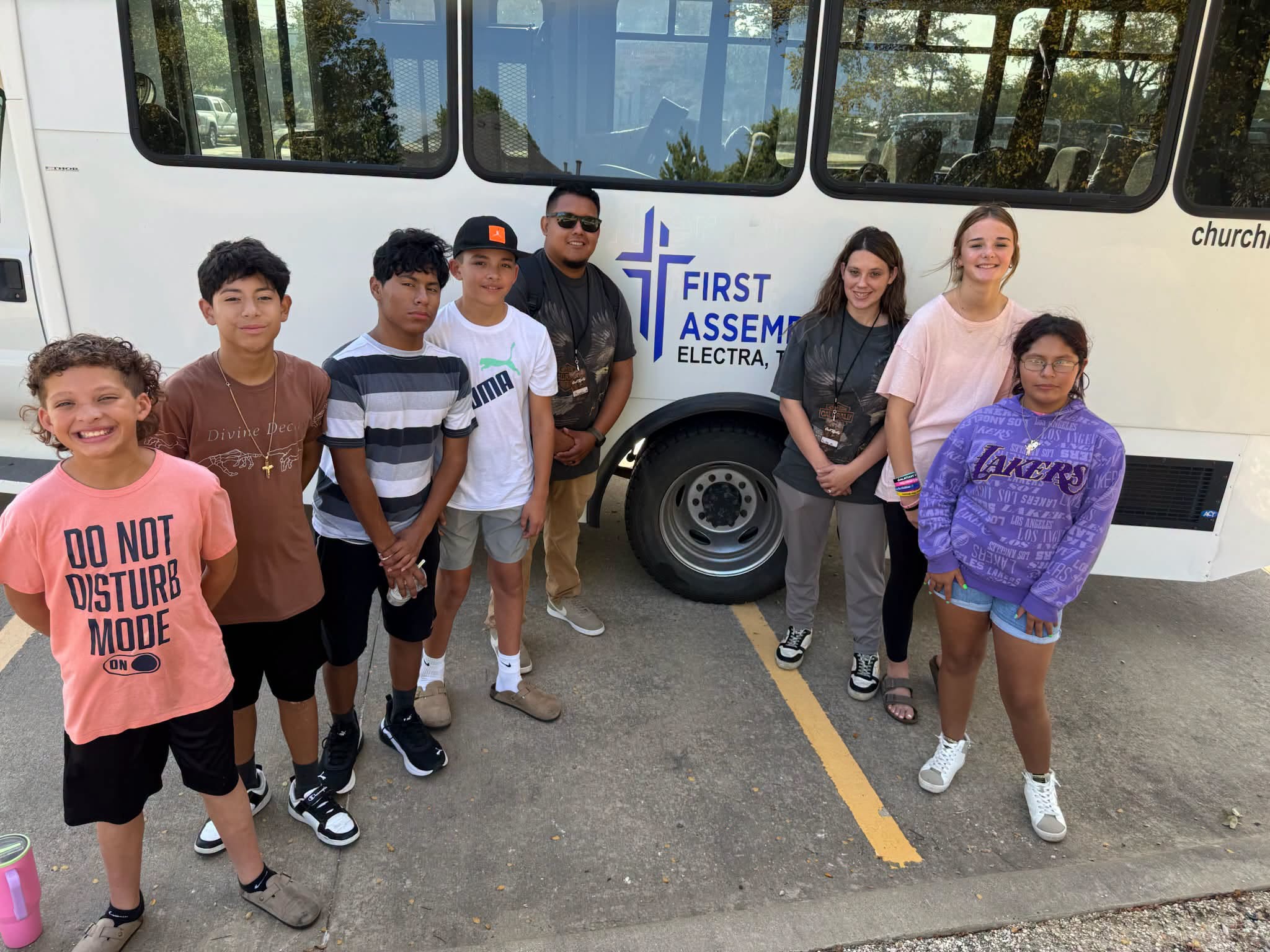 Faith Center youth gathered beside the church bus